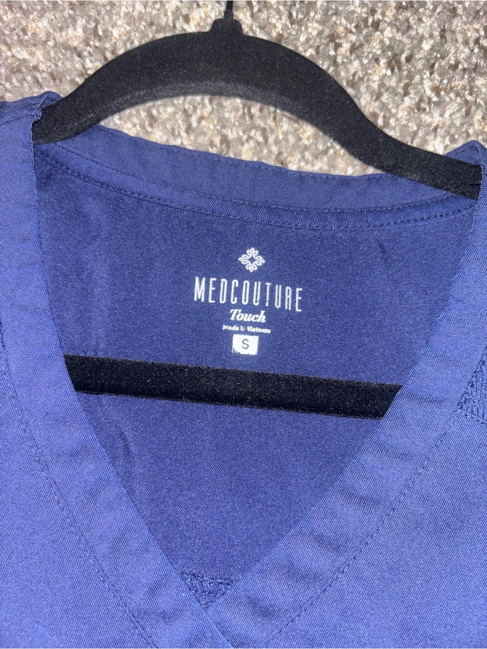 MedCouture Touch Navy V-Neck Scrub Top and jogger pants.